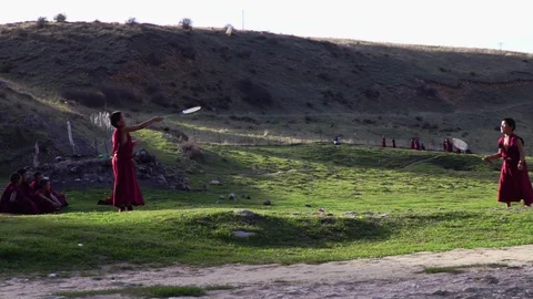 Students of the Buddhist monastery having a rest. Langmusi, Eastern Tibet, China Видео 100197467
