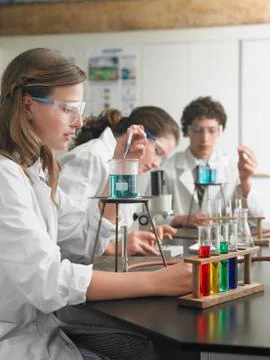 Students Caring Out Experiments In Laboratory Stock Photos