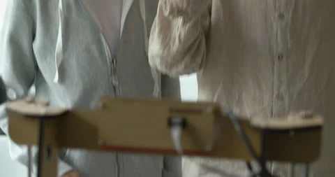 Students checking their 3D printed prototype Stock Footage 168338378