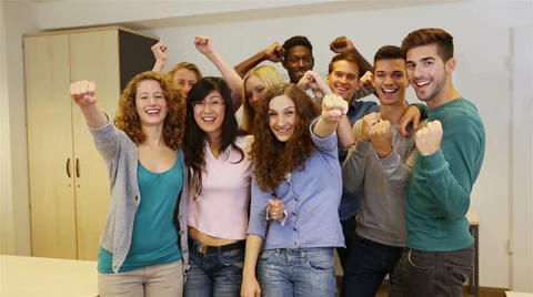Students cheering in classroom Stock Footage 32818827