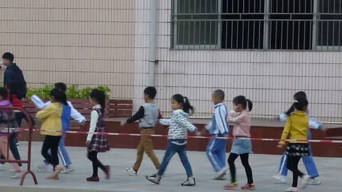 Students on the Chinese elementary school line up to the playground Stock Footage 70535223