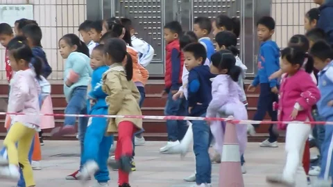 Students on the Chinese elementary school line up to the playground 스톡 동영상 70543393