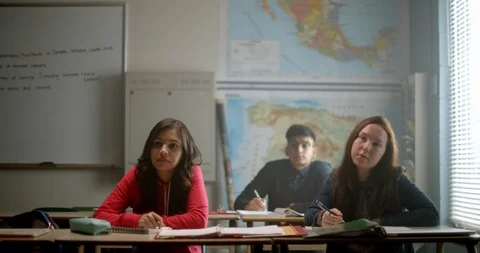 Students in class listen to teacher while at school 스톡 동영상 118141562