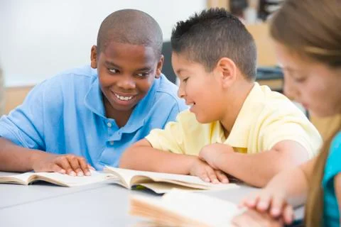 Students in class reading together (selective focus) Stock Photos
