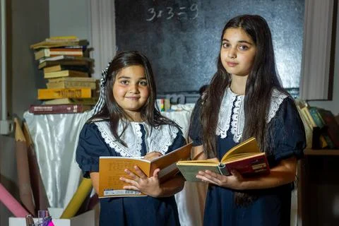 Students in classroom doing homework Stock Photos