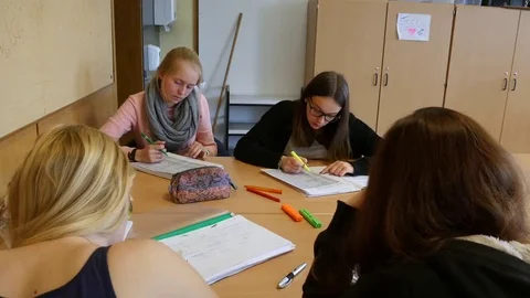 Students in the classroom during a writing task. Stock Footage 69320321