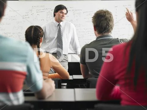 Students In Classroom With Professor Stock Photos