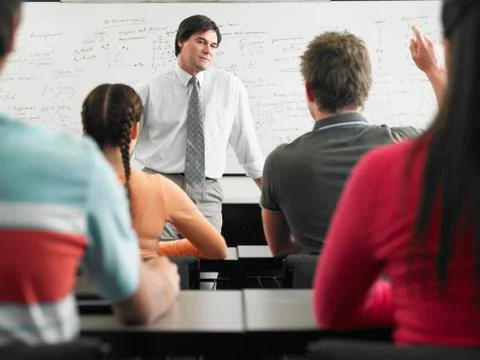 Students In Classroom With Professor Stock Photos
