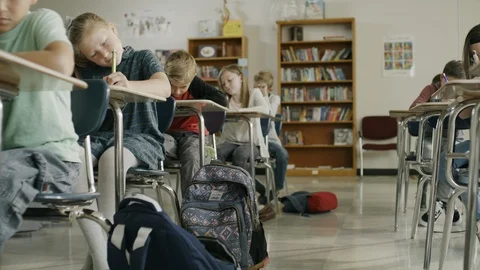 Students in classroom surprised by earthquake drill hiding under desks ,Provo, Stock-Footage 85911075