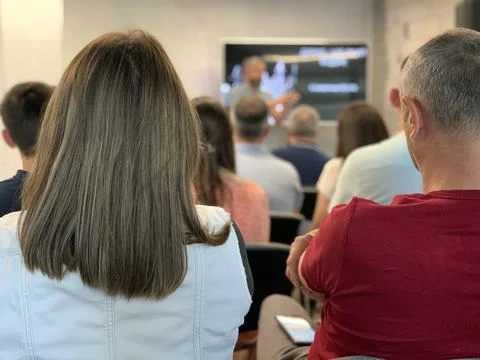 Students in the classroom, view from the back. Meeting of the working team at Stock Photos