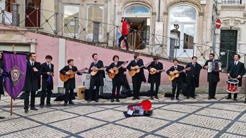 Students of Coimbra in Portugal playing and singing traditional music Stock-Footage 278094853