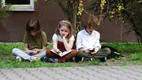 Students communicate in social networks using smartphones, the girl wants to Stock Footage 89757294