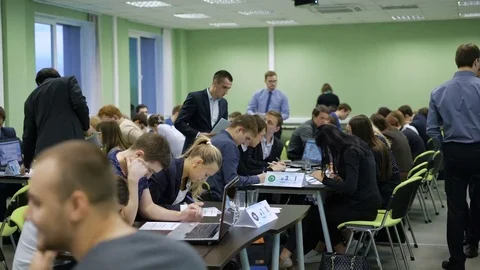 Students complete their task quickly and pass the examination papers. Ends the Stock-Footage 70938780