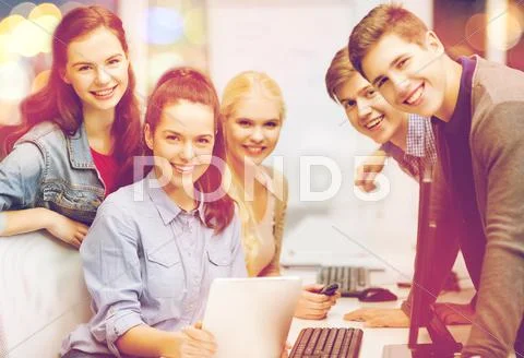 Students with computer monitor and tablet pc Stock Photos