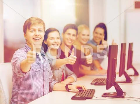 Students with computer monitor showing thumbs up Stock Photos