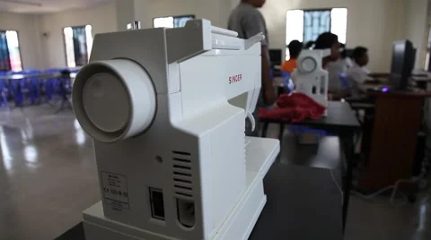Students on computers while sewing machine idle Cambodia Stock Footage 48020852