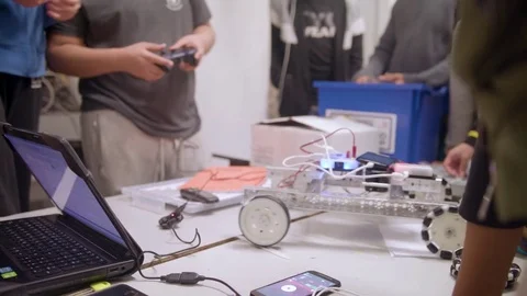 Students controlling robot they made Stock Footage 81203609