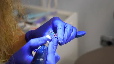 Students of dentists learn to fill the root canals of artificial teeth. Stmatlog Stock Footage 124324537