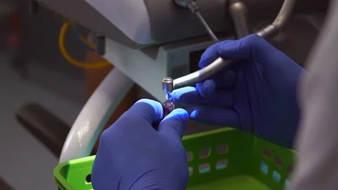 Students of dentists learn to fill the root canals of artificial teeth Stock Footage 124324548