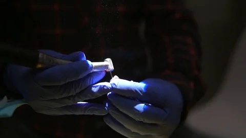 Students of dentists learn to fill the root canals of artificial teeth Stock Footage 124324569