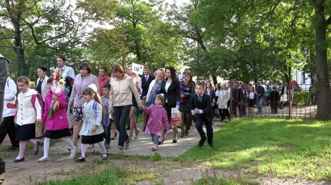 Students of different classes in the school dress greeted the Day of Knowledge Stock Footage 65765095