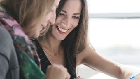 Students discuss a business plan in a bright room at the table. Video stock 86162385