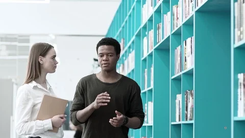 Students discussing books Stock Footage 91728774