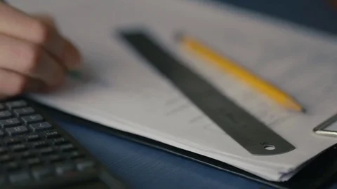 Students doing homework and preparing exam at university, closeup of young woman Stock Footage 72825566