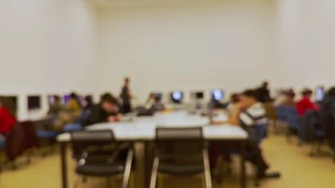 Students doing homework on the computer in class and listening to the Stock Footage 288198197