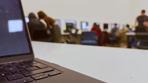 Students doing homework on the computer in class and listening to the Stock Footage 288198219