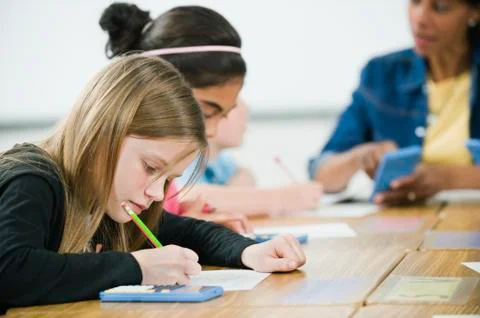 Students doing math work in classroom Foto stock