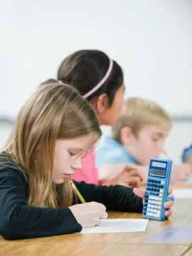 Students doing math work in classroom Foto stock