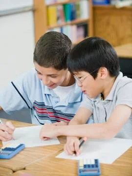 Students doing math work in classroom Foto stock