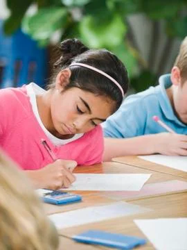 Students doing math work in classroom Stock Photos