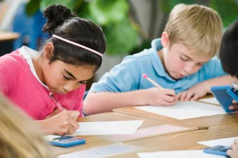 Students doing math work in classroom Stock Photos