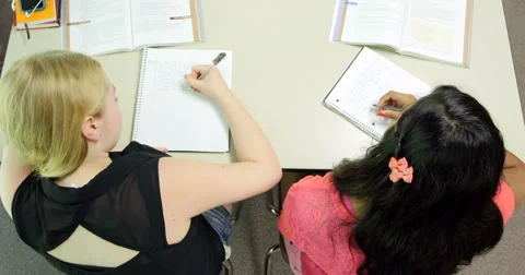 Students doing their assignments/homework in class. Ultra HD 4K Video stock 44406129