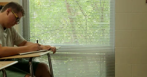 Students doing their school assignments and homework in class. Ultra HD 4K Stock Footage 45573341