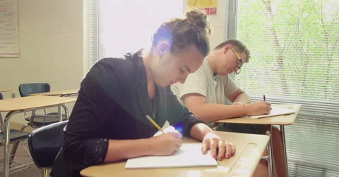 Students doing their school assignments and homework in class. Ultra HD 4K Stock-Footage 46599266