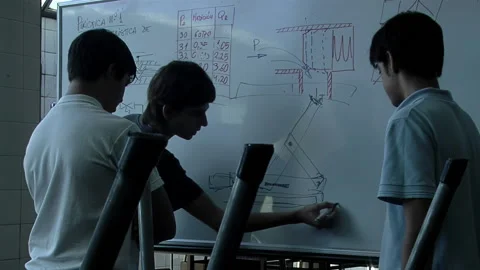 Students Drawing an Electrical Circuit Board in an Empty Classroom After Hours. Video stock 233386717
