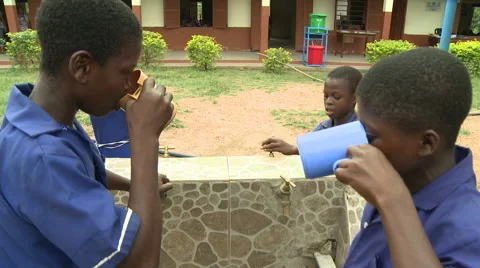 STUDENTS DRINK WATER BY THE FAUCETS Stock Footage 60633545