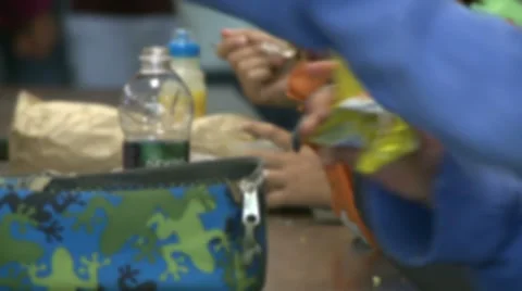Students eating lunch in cafeteria. (2 of 2) Stock Footage 8696974