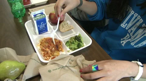 Students eating school bought lunch.  (1 of 2) Stock Footage 8697073