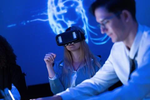 Students engage in virtual reality learning experience in a high-tech class.. Stock Photos