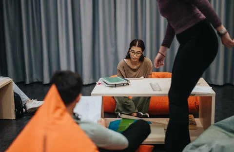 Students engaged in collaborative learning at school in a relaxed setting with 스톡 사진