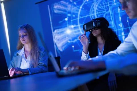 Students engaged in virtual reality training in modern classroom setting Stock Photos