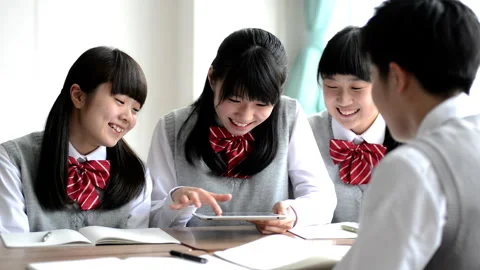 Students Engaging in Group Learning with Tablets Видео 332542069
