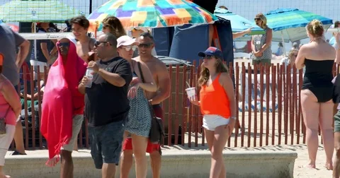Students enjoy spring break party on Santa Monica Beach, Los Angeles, 4K Stock Footage 74909614