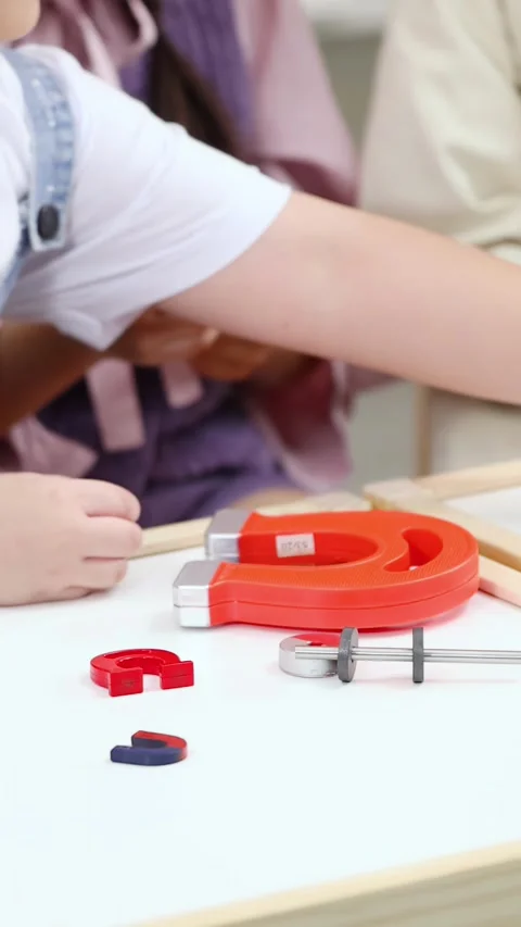 Students Exploring Magnetic Force During Hands-On STEM Learning Activity Stock Footage 328346085