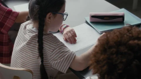 Students Filling Out Multiple Choice Test Sheet in Classroom Stock Footage 311539429