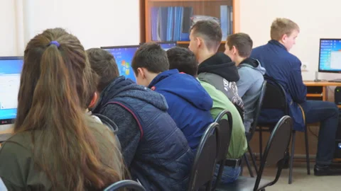 Students in front of computers in a computer class Video stock 107005644